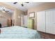 Bright bedroom with a queen bed, dresser, and large closet at 7156 S Forest Ave, Gilbert, AZ 85298