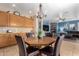 Casual dining area with wood table, chairs, and kitchen views at 7156 S Forest Ave, Gilbert, AZ 85298