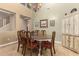 Formal dining room with wood table and antique china cabinet at 7156 S Forest Ave, Gilbert, AZ 85298