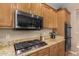 Stainless steel appliances and granite countertops highlight this kitchen at 7156 S Forest Ave, Gilbert, AZ 85298
