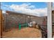 Desert landscaped backyard featuring block wall, dirt and storage items at 20025 W Madison St, Buckeye, AZ 85326