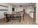 Dining table with an open concept layout to the kitchen, bar, and living room at 20025 W Madison St, Buckeye, AZ 85326