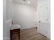 Bright hallway with wood floors, leading to various rooms in the home at 20025 W Madison St, Buckeye, AZ 85326