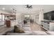 A living room featuring a large couch, dining table, and kitchen area in an open concept layout at 20025 W Madison St, Buckeye, AZ 85326