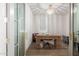 Home office space with beautiful wood desk, chandelier and serene natural light at 20025 W Madison St, Buckeye, AZ 85326