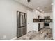 Modern white kitchen with stainless steel appliances at 9622 W Cinnabar Ave # B, Peoria, AZ 85345