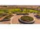 Landscaped circular seating area with integrated garden at 10130 S Bickwell Trl, Apache Junction, AZ 85120
