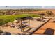 Outdoor game area with shaded picnic tables and ping pong at 10130 S Bickwell Trl, Apache Junction, AZ 85120