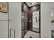 Modern bathroom with a walk-in shower and herringbone tile floor at 2652 E Pelican Ct, Gilbert, AZ 85297