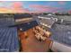 Aerial view of a cozy courtyard featuring a comfortable seating area with string lights and sunset views at 2652 E Pelican Ct, Gilbert, AZ 85297