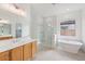 Elegant bathroom with soaking tub, double vanity, and walk-in shower at 22837 E Alyssa Rd, Queen Creek, AZ 85142