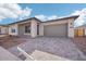 Modern home with gray exterior, paved driveway, and attached garage at 22837 E Alyssa Rd, Queen Creek, AZ 85142