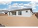 Rear view of the house showcasing its design and backyard at 22837 E Alyssa Rd, Queen Creek, AZ 85142