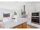 Modern kitchen with island and stainless steel appliances at 22837 E Alyssa Rd, Queen Creek, AZ 85142