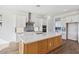 Modern kitchen with white cabinets and center island at 22837 E Alyssa Rd, Queen Creek, AZ 85142