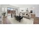 Bright living room with hardwood floors and access to backyard at 22837 E Alyssa Rd, Queen Creek, AZ 85142