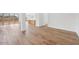 Open concept living space with wood-look tile flooring and kitchen view at 22837 E Alyssa Rd, Queen Creek, AZ 85142