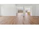 Open living area with wood-look floors and views to kitchen and backyard at 22837 E Alyssa Rd, Queen Creek, AZ 85142