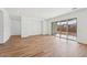 Spacious living room with wood-look tile flooring and sliding glass doors at 22837 E Alyssa Rd, Queen Creek, AZ 85142