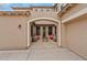 Covered front patio featuring a cozy seating area with chairs, barrels, and a fire pit at 3353 E Blue Ridge Way, Gilbert, AZ 85298