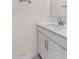 Bright bathroom featuring a white sink, modern faucet, and updated cabinets at 7453 S 75Th Dr, Laveen, AZ 85339