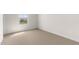 Well-lit bedroom with neutral carpet and window with a view at 7453 S 75Th Dr, Laveen, AZ 85339