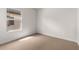 Well-lit bedroom featuring neutral carpet and a window with blinds at 7453 S 75Th Dr, Laveen, AZ 85339
