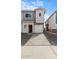 Two-story townhome with attached garage and modern architectural details at 7453 S 75Th Dr, Laveen, AZ 85339