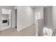 Upstairs hallway with laundry room featuring modern appliances at 7453 S 75Th Dr, Laveen, AZ 85339