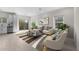 Bright living area with modern decor, neutral tones, and large windows at 7453 S 75Th Dr, Laveen, AZ 85339