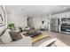 Open-concept living space with modern furniture, kitchen, and dining area at 7453 S 75Th Dr, Laveen, AZ 85339