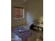 Neutral room with wood floors, horizontal blinds and fur rug at 12009 W Aster Dr, El Mirage, AZ 85335