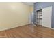 Bedroom with wood flooring and sliding door closet at 3486 W Belle Ave, San Tan Valley, AZ 85144