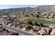 Aerial view showing home's location near golf course and mountains at 1538 E Windsong Dr, Phoenix, AZ 85048