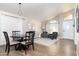 Formal dining area with a round table and four chairs, featuring hardwood floors at 1538 E Windsong Dr, Phoenix, AZ 85048