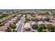 Birds-eye view of a tranquil neighborhood showcasing well-maintained homes and lush greenery at 17552 W Young St, Surprise, AZ 85388