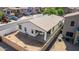 Spacious backyard of a white house with covered patio, perfect for outdoor living and entertaining in style at 17552 W Young St, Surprise, AZ 85388