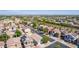 Overview of a well-planned community with diverse home styles, lush greenery, and Gathering-friendly environment at 17552 W Young St, Surprise, AZ 85388