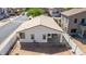 Fenced in backyard of a white house with patio in residential neighborhood, ready for personalization at 17552 W Young St, Surprise, AZ 85388