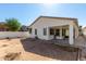 Home exterior featuring stucco, windows, and a covered back patio at 17552 W Young St, Surprise, AZ 85388