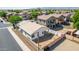A partially fenced backyard with potential for landscaping, adjacent to a well-kept neighborhood street at 17552 W Young St, Surprise, AZ 85388