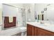 Bathroom with white shower and brown vanity at 17552 W Young St, Surprise, AZ 85388