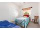 Charming bedroom with a twin bed, a window, and carpet flooring, creating a cozy, inviting space at 17552 W Young St, Surprise, AZ 85388