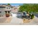 Aerial view of a home with desert landscaping, a driveway, and a two-car garage at 17552 W Young St, Surprise, AZ 85388