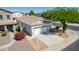 Aerial view of a home with desert landscaping, a driveway, and a two-car garage at 17552 W Young St, Surprise, AZ 85388