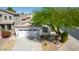 Aerial view of a home with desert landscaping, a driveway, and a two-car garage at 17552 W Young St, Surprise, AZ 85388