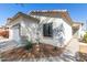 This house features a charming water fountain, xeriscaping, and an attractive exterior paint job at 17552 W Young St, Surprise, AZ 85388