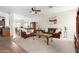 Spacious living room with plush carpeting and stylish brown sofas and decor at 17552 W Young St, Surprise, AZ 85388