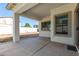 Back patio with neutral walls and concrete flooring at 17552 W Young St, Surprise, AZ 85388