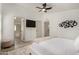 Clean bedroom with a modern bed, light colored walls, and en suite bath access at 2233 E Behrend Dr # 210, Phoenix, AZ 85024